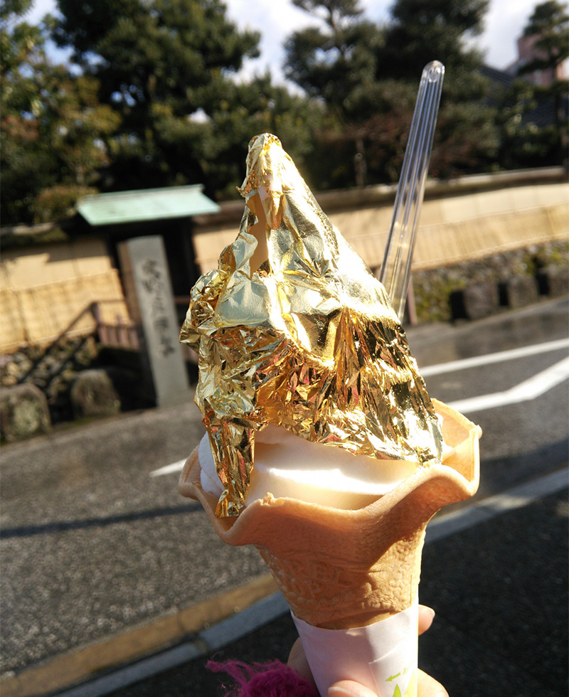 Soft serve ice cream topped with gold leaf