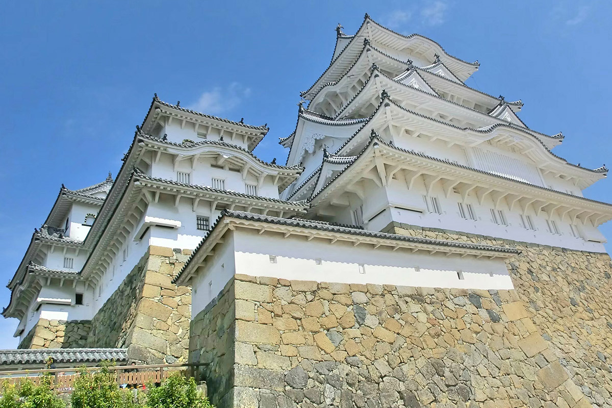 Tombstones and sarcophagi are incorporated into the stone walls of Himeji Castle.
