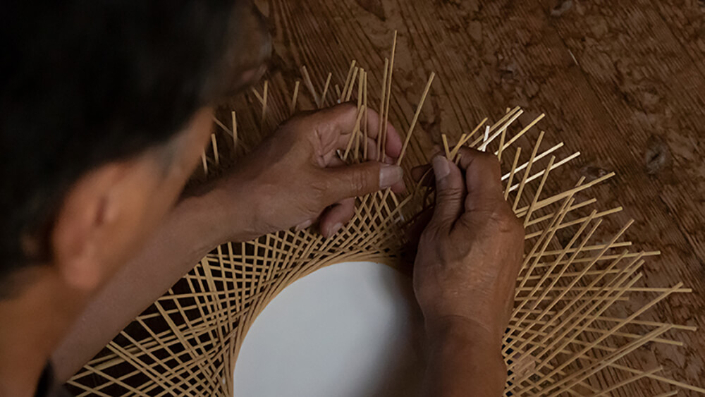 Weaving bamboo by hand