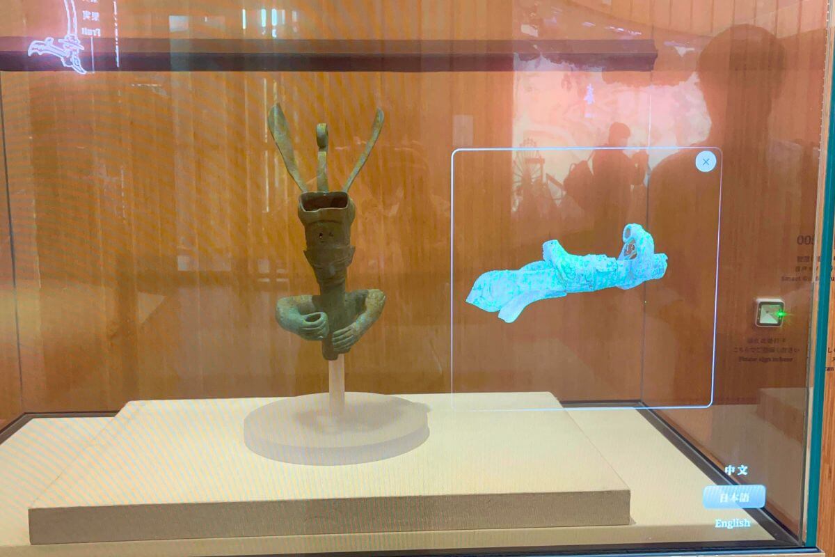 Replica of bronze animal-headed crowned figure