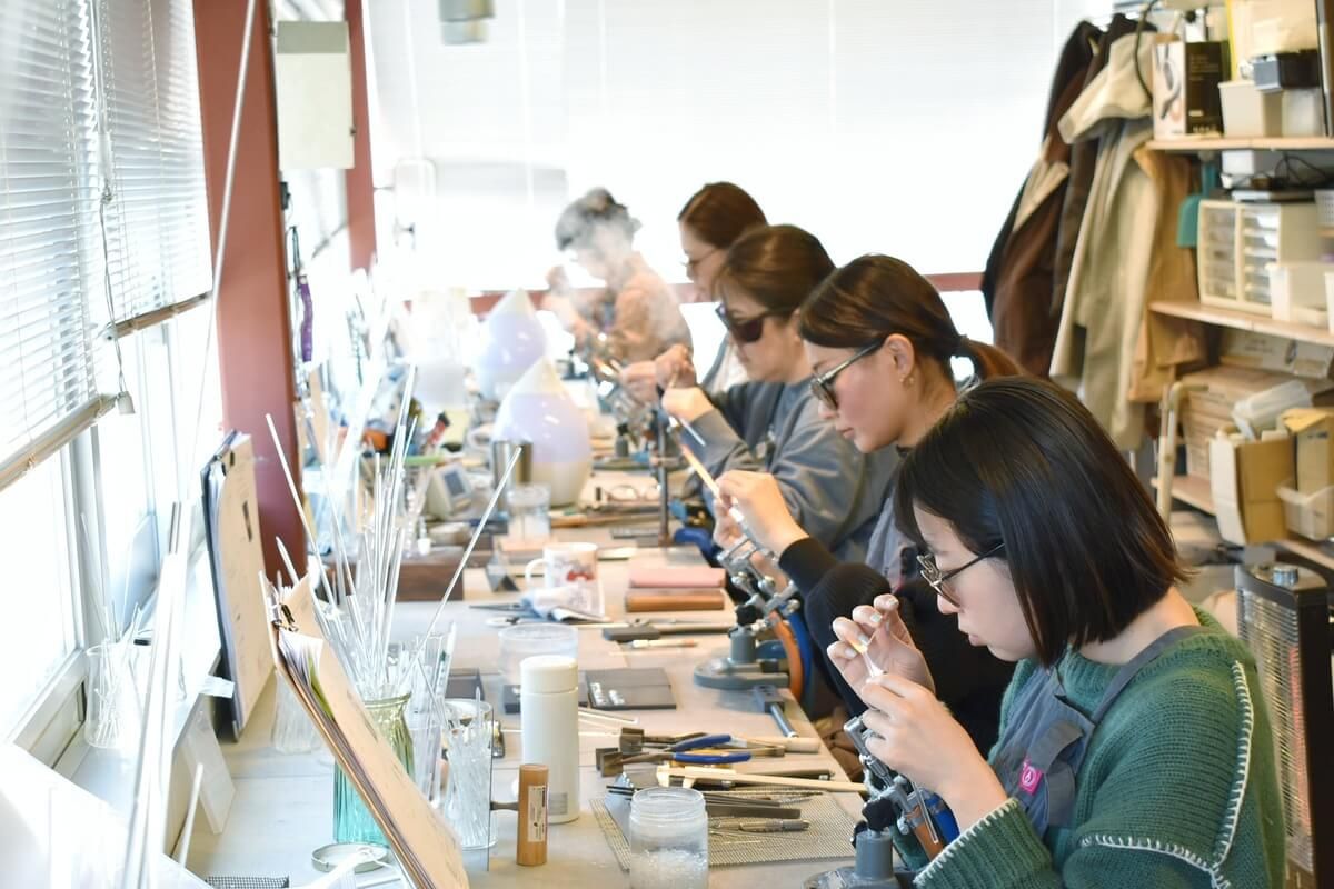 Lampworkers (glass artisans) working at iriser