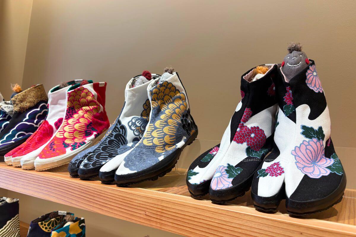 Tabi shoes featuring a vibrant design inspired by Japanese flowers